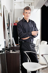 Image showing Confident Male Hairdresser With Scissors At Salon