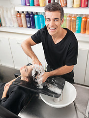 Image showing Hairstylist Washing Customer's Hair