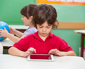 Image showing Boy Using Digital Tablet At Desk