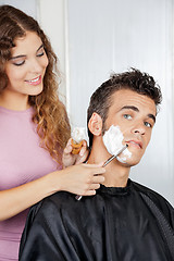 Image showing Man Getting A Shave From Female Barber