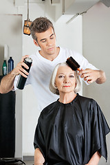 Image showing Woman With Hairdresser Styling Hair At Salon