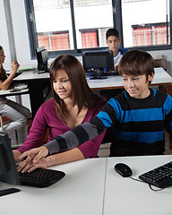 Image showing Teenage Schoolboy Pointing At Computer Monitor