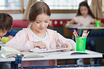 Image showing Schoolgirl Using Digital Tablet In Classroom
