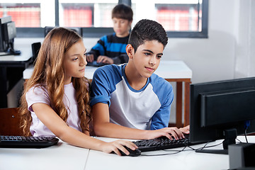 Image showing Friends Using Desktop Pc In School Lab