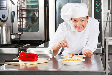 Image showing Chef Sprinkling Spices On Food