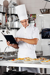 Image showing Chef Going Over Cooking Checklist