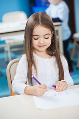 Image showing Girl Drawing With Sketch Pen At Desk