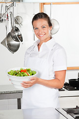 Image showing Female Chef Holding Bowl Of Salad