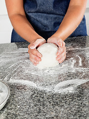 Image showing Female Chef Kneading Dough