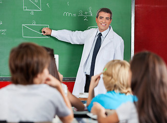 Image showing Teacher Teaching Geometry To Schoolchildren