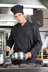 Image showing Confident Chef Preparing Food