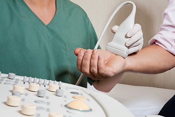 Image showing Technician Scanning Male Patient's Hand