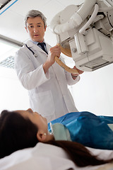 Image showing Radiologist Looking At Female Patient