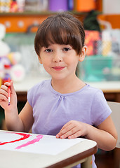 Image showing Cute Little Girl Painting In Art Class