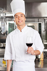 Image showing Chef Holding Glass Of Red Wine