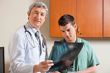 Image showing Radiologist Standing With Male Technician