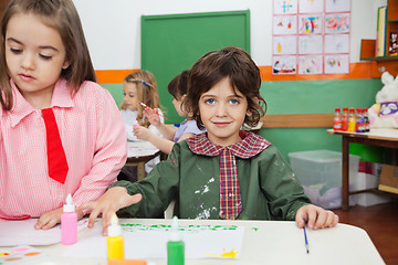 Image showing Boy Painting With Friend In Art Class