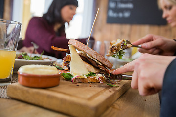 Image showing Businessman Having Burger With Colleagues