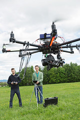 Image showing Technicians Flying UAV Spy Drone