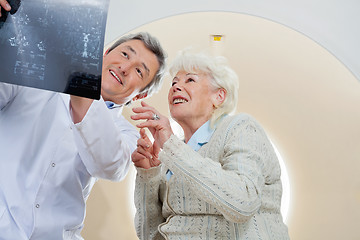 Image showing Doctor With Patient Looking At MRI X-ray