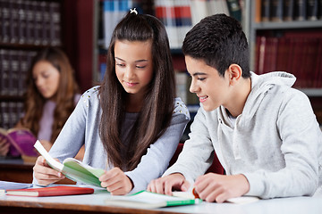 Image showing Teenage Friends Studying Together At Desk