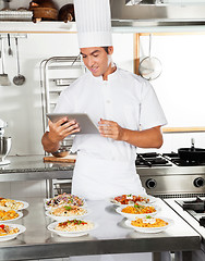 Image showing Happy Chef Using Digital Tablet