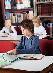 Image showing Schoolboy Studying In Library