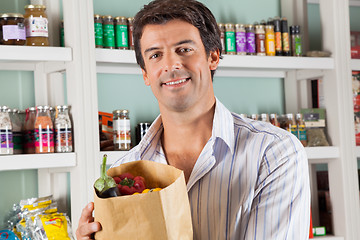Image showing Male Customer With Vegetable Bag In Supermarket