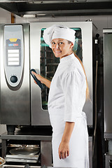Image showing Chef Holding Handle Of Oven
