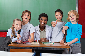 Image showing Schoolchildren Gesturing Thumbs Up