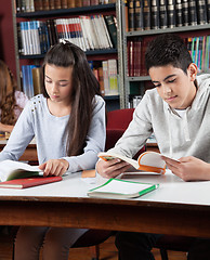 Image showing Schoolchildren Reading Books In Library
