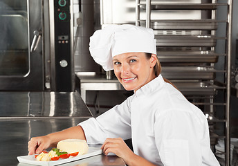 Image showing Female Chef With Dish At Counter
