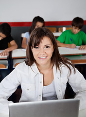 Image showing Beautiful Teenage Schoolgirl Sitting With Laptop