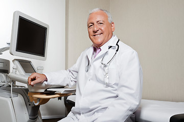 Image showing Radiologist Sitting By Ultrasonic Machine