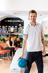 Image showing Man With Bowling Ball in Club