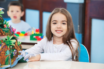 Image showing Little Girl With Popup Book In Preschool