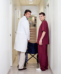 Image showing Doctor And Male Nurse In Hospital Corridor