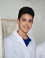 Image showing Teenage Schoolboy Wearing Labcoat In Science Lab