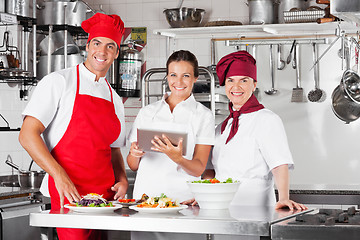 Image showing Happy Chefs Using Tablet Computer In Kitchen