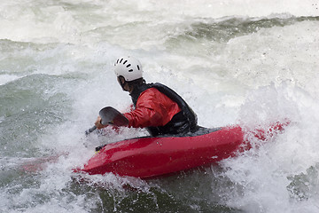 Image showing Red kayak in action