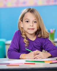 Image showing Girl With Colored Sketch Pens And Paper At Desk