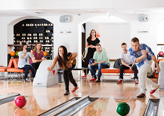 Image showing Young Friends Playing in Bowling Alley