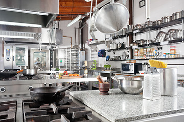 Image showing Utensils On Counter In Commercial Kitchen