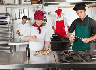 Image showing Chefs Working In Restaurant Kitchen