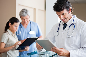 Image showing Male Doctor Holding Digital Tablet