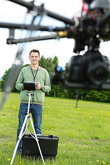 Image showing Male Engineer Flying UAV Octocopter