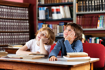 Image showing Thoughtful Schoolboys Sitting In Library