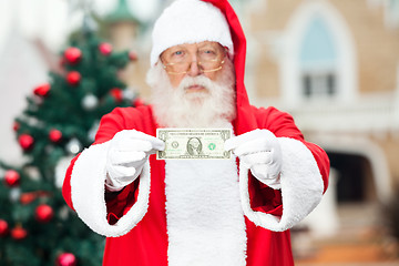 Image showing Santa Claus Showing One Dollar Note