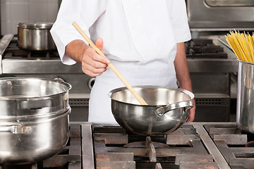 Image showing Male Chef Preparing Food