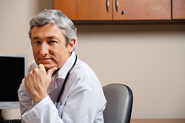 Image showing Serious Doctor With Hand On Chin